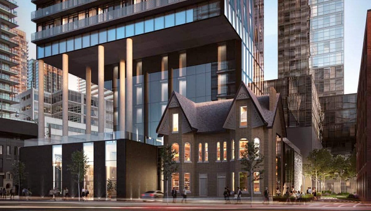 Exterior rendering of Carlyle Condos street-level at dusk.