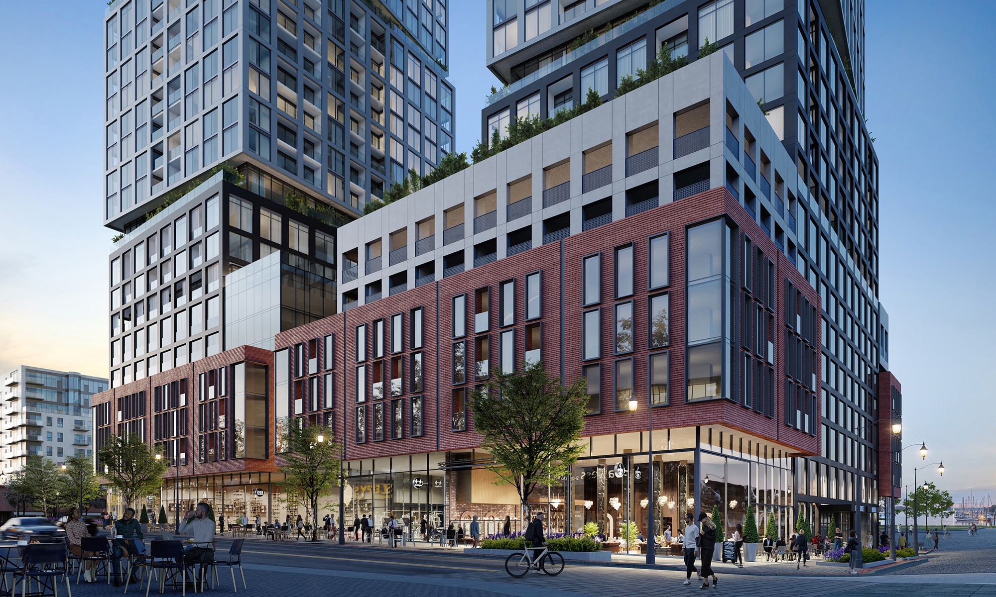 Rendering of Debut Waterfront Residences building exterior at street-level in the evening.