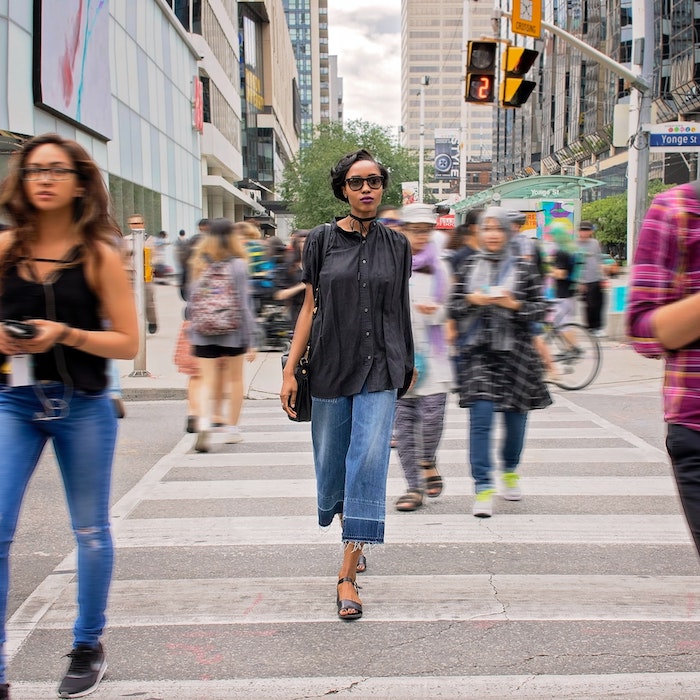 Woman Walking in Downtown Toronto, Canada.