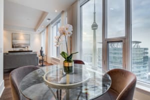 Ten York 66th Floor Signature Suite dining view of CN Tower.