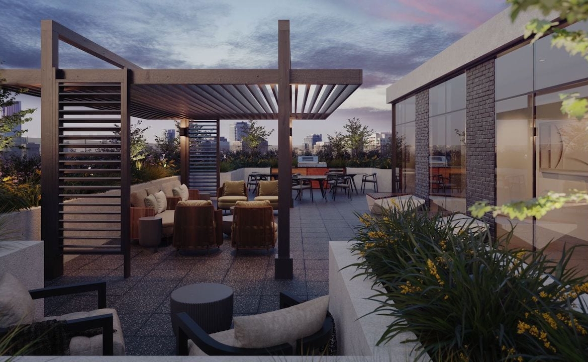 Rendering of Motto Condos BBQ rooftop in the evening
