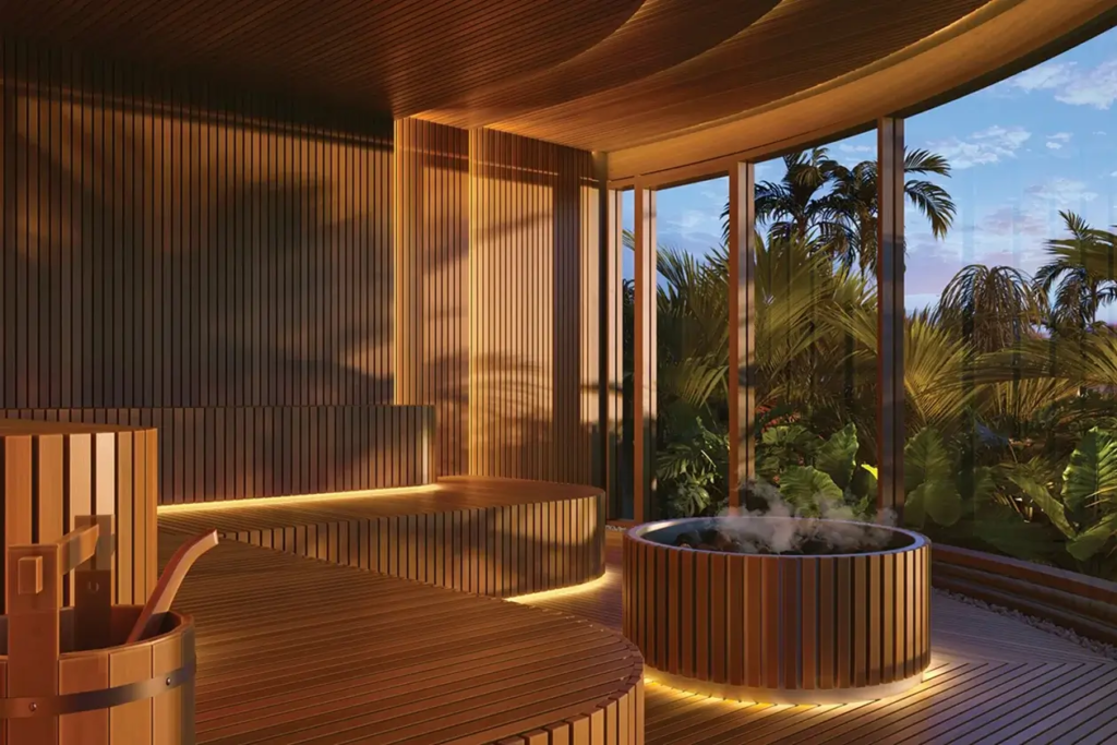 Exquisite wooden sauna room at Vie L'Ven luxury resort, surrounded by lush tropical greenery of St. Maarten.