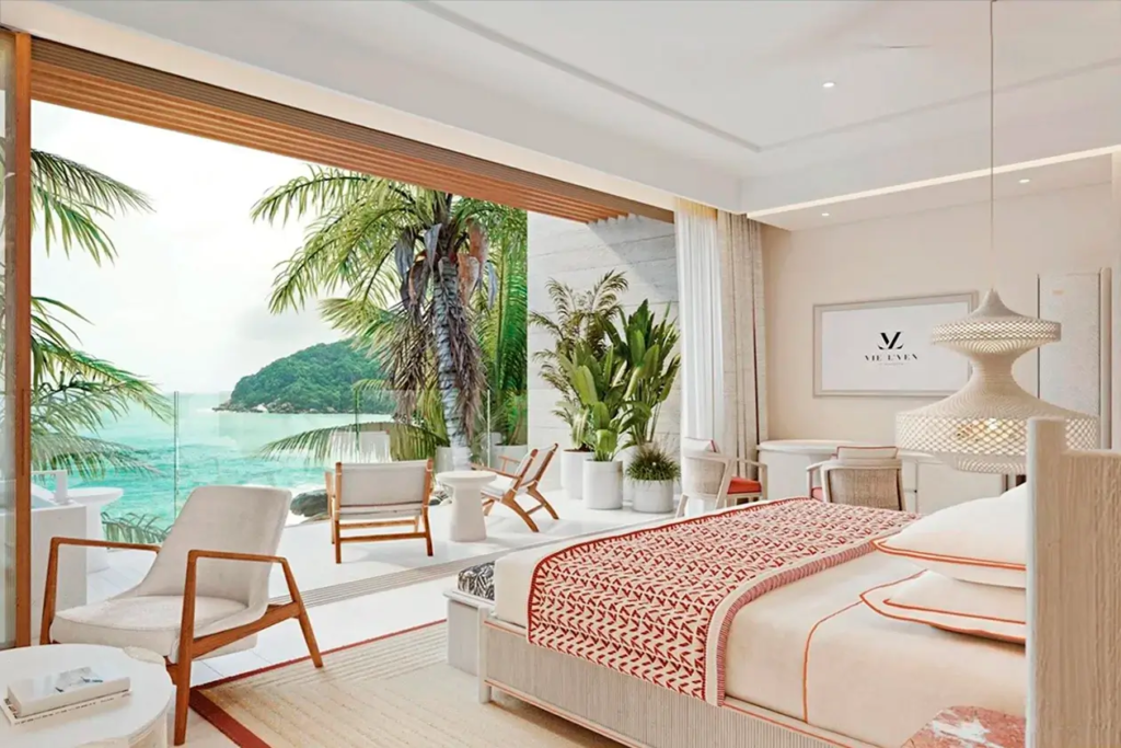 Luxury oceanfront bedroom at Vie L'Ven with a panoramic view of the turquoise waters of St. Maarten.